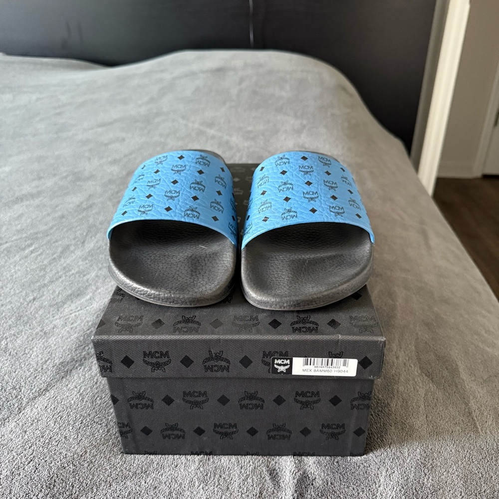 MCM Black and Blue Logo Slides